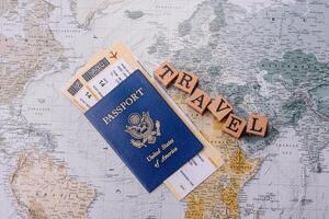 Conceptual background for travel with passport, magnifying glass, world map and money photo