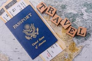 Conceptual background for travel with passport, magnifying glass, world map and money photo