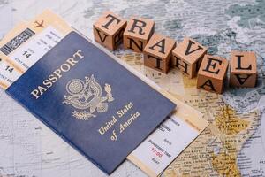 Conceptual background for travel with passport, magnifying glass, world map and money photo