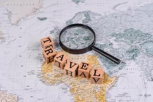 Conceptual background for travel with passport, magnifying glass, world map and money photo