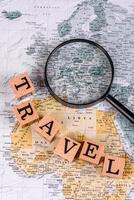 Conceptual background for travel with passport, magnifying glass, world map and money photo