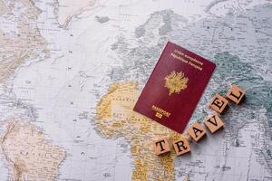 Conceptual background for travel with passport, magnifying glass, world map and money photo