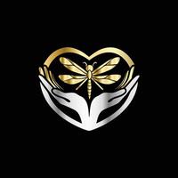 golden dragonfly logo with hands holding a heart vector