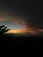 sunset seen from the top of the hill at dusk photo