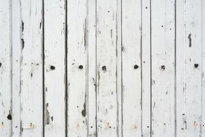 Textured white wood planks with rustic details and visible wear photo