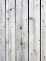 Natural wood planks with a weathered gray finish arranged vertically photo