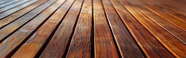 Close-up of warm brown wood decking with a smooth finish in sunlight photo
