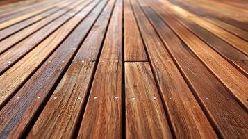 Beautifully polished wood decking with rich brown tones on sunny day photo