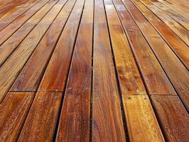 Wooden decking planks in warm tones on a sunny day photo