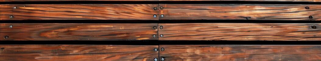 Wooden decking boards with screws in a close-up view during daylight photo