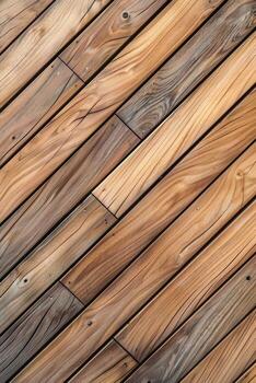 Wooden decking in a warm, natural finish arranged in a diagonal pattern photo