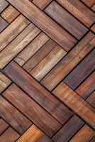 Wood decking arranged in a herringbone pattern in warm tones photo