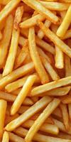 Crispy golden French fries served as a popular snack or side dish photo