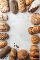 Freshly baked artisanal bread arranged creatively on a neutral backdrop photo