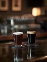 Two glasses of dark and light beer on a bar counter at night photo