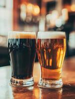 Two glasses of dark and light beer on a rustic bar counter photo