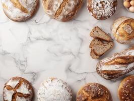 Freshly baked artisanal bread on a marble countertop with copy space photo