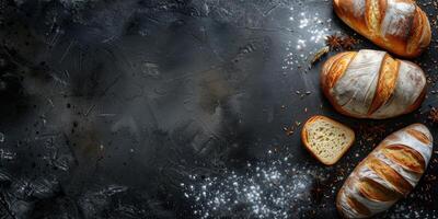 Freshly baked artisan bread on a dark rustic surface photo