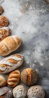 Freshly baked artisan bread assortment on a textured surface photo
