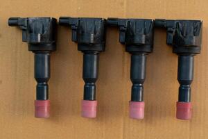 Above view of spark plug of sparking of car. Place on brown paper. photo