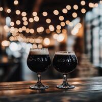 Two glasses of dark and light beer on a bar counter with ambient lights photo