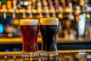 Two glasses of dark and light beer on a bar counter at night photo