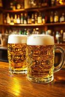 Beer mugs filled with foam on a wooden table in a cozy bar photo