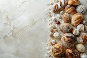Freshly baked artisan bread arranged on a light marble surface photo
