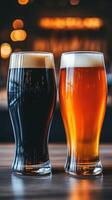 Glasses of dark and light beer on bar counter with warm ambiance photo
