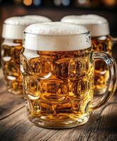 Beer mugs filled with foam on a wooden bar table photo