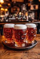 Refreshing beer mugs with foam on a bar table in a cozy pub photo