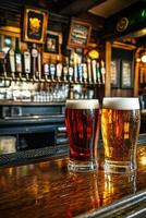 Two glasses of beer on a bar counter in a cozy pub setting photo
