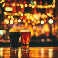 Two glasses of dark and light beer on a bar counter with warm lighting photo