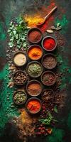 Assorted Indian spices in traditional bowls on a rustic surface photo