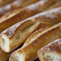 Freshly baked pastries lined up on a wooden surface photo