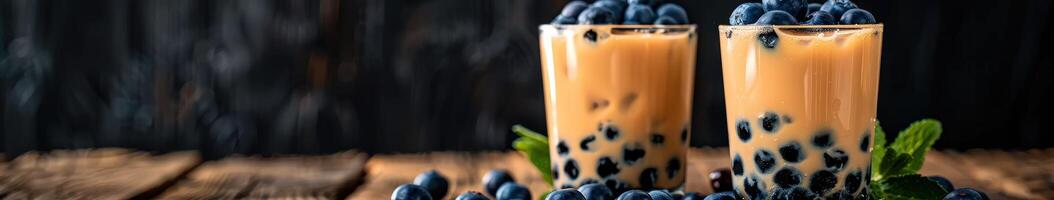 Boba milk tea with fresh blueberries on a wooden table photo