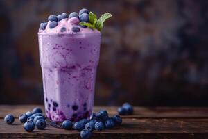 Refreshing boba milk tea topped with fresh blueberries and mint leaves photo