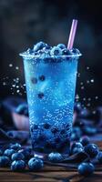 Boba milk tea topped with fresh blueberries in a vibrant setting photo