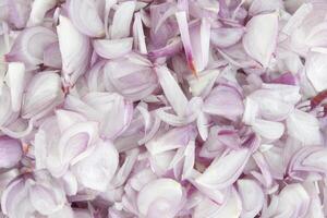 Top view of Sliced peeled shallot in cooking ingredients for background. photo