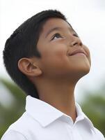 High school boy gazing up at the cloudy sky in the afternoon photo