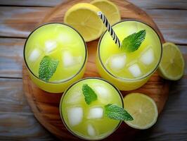 Refreshing green mint lemonade served in glasses with ice cubes photo