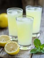 Refreshing green mint lemonade served in glasses with ice photo