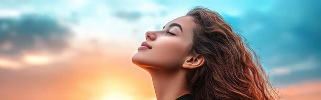 High school girl gazing thoughtfully at the evening sky photo