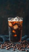Iced coffee with cream garnished with coffee beans on a dark background photo