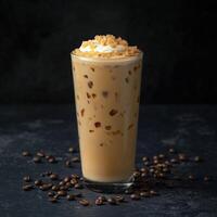 Iced coffee with cream topped with crunchy caramel pieces photo