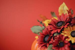 Autumn flowers and pumpkins with vibrant colors and ample copy space photo
