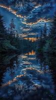 Night clouds reflected on still water in a tranquil forest lake photo