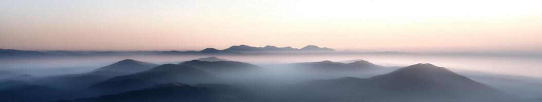 Evening fog envelops tranquil mountains at dusk photo