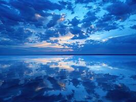 Night clouds reflect on tranquil lake under a starry sky photo
