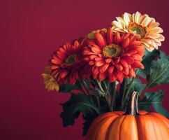 Vibrant autumn arrangement of flowers and pumpkins with copy space photo